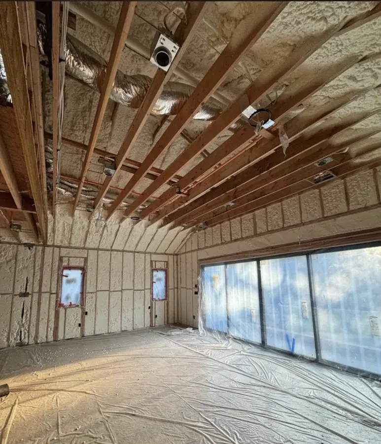 Interior walls and ceiling insulated with spray foam during new construction in Tewksbury